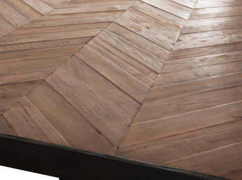 Mesa de comedor rectangular con patas en forma de cruz.